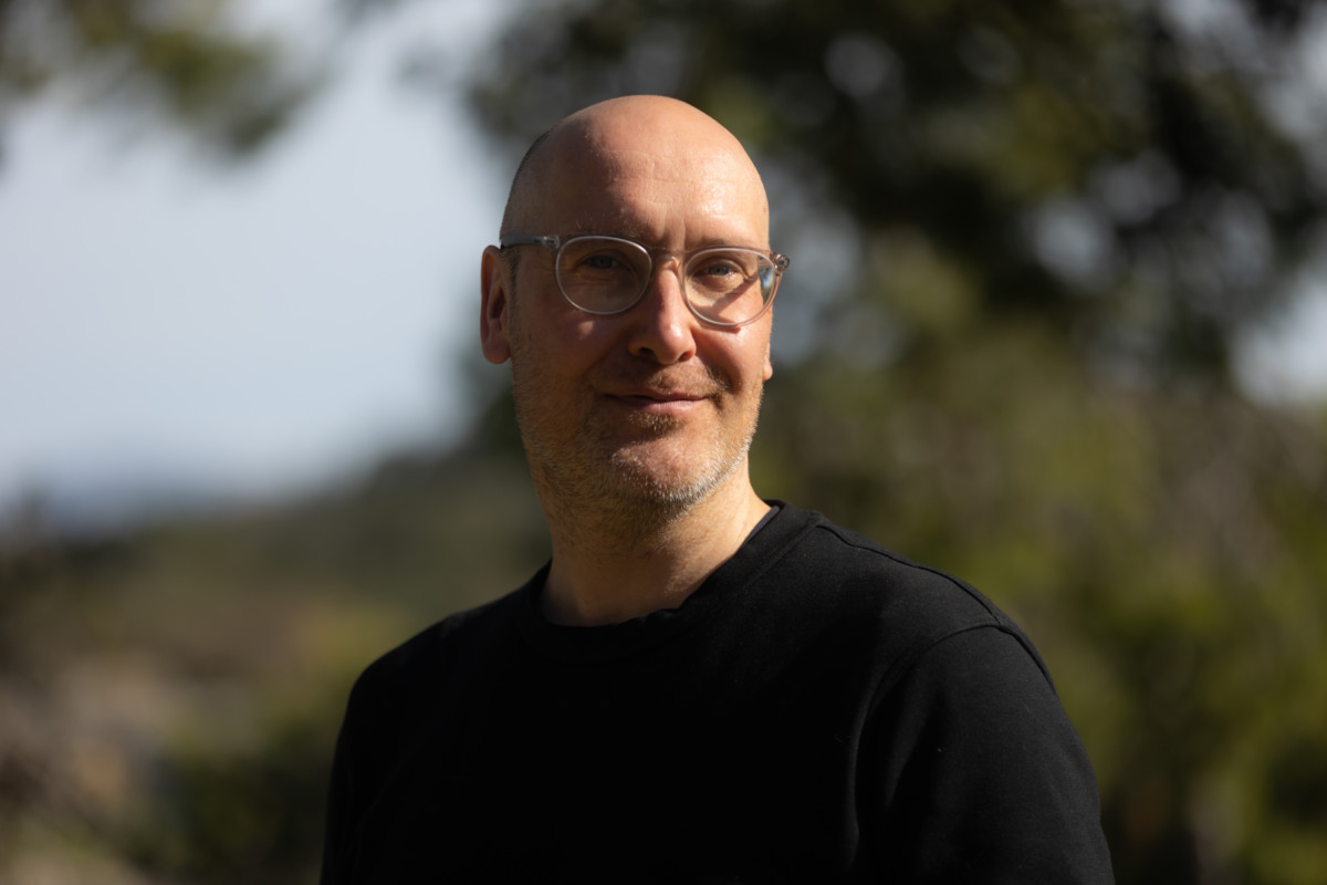 Advisory Board member Jussi Parikka, a smiling man with glasses